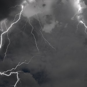 May include: A dramatic image of lightning bolts striking through dark storm clouds.
