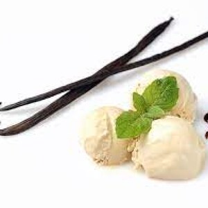 May include: Three scoops of vanilla ice cream topped with fresh mint leaves and vanilla beans.