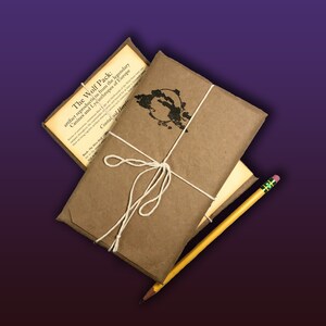 May include: A brown paper package tied with twine and a yellow pencil. The package is labeled "The Wolf Pack: artifact reproductions from the legendary Canines and Lycinthropes of Europe. Contained Herein."