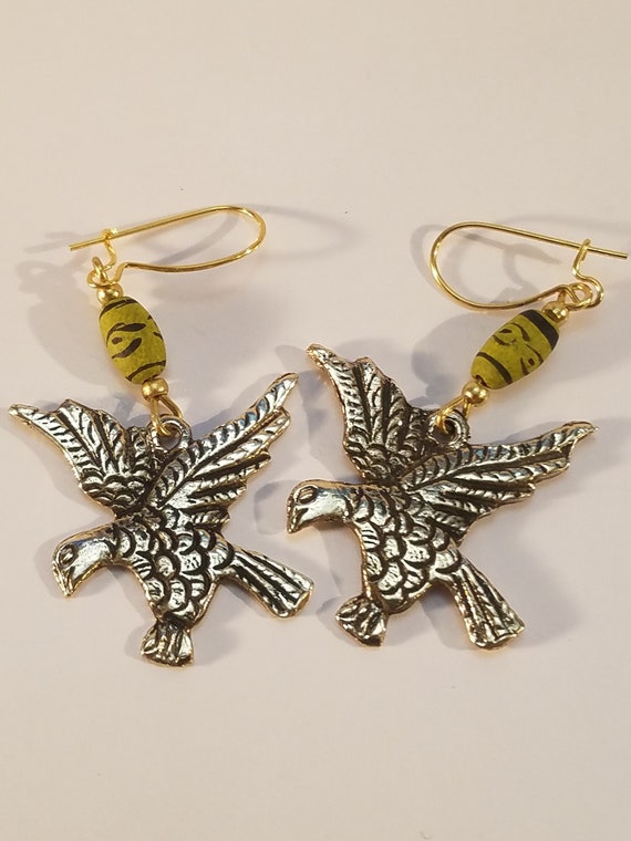 Bronze earring and Peruvian Condors ceramics