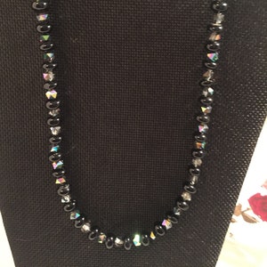 Necklace is made with silver,black and white rondelle beads and silver findings
