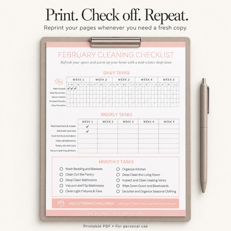 Printed monthly cleaning checklist on a clipboard beside a pen, ready to complete by hand.