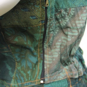 May include: A green and brown patchwork dress with a zip up the back.