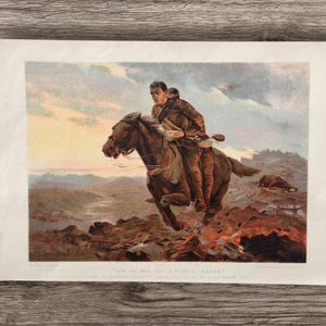 May include: A vintage color print titled "How We Won the Victoria Cross" depicting a soldier in uniform riding a brown horse across a rugged, smoky landscape. The scene features a dramatic sky, distant mountains, and a body of water.