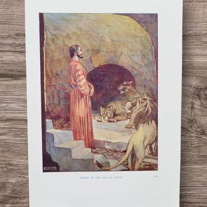 Originale libro d'epoca degli anni '30 "Daniele nella fossa dei leoni", illustrazione litografica, storie bibliche della Sacra Bibbia, leoni e tigri