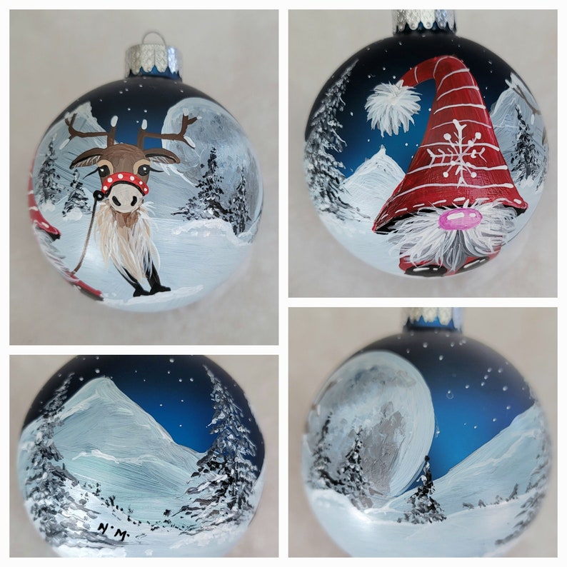 May include: Four hand-painted Christmas ornaments with winter scenes. One ornament features a reindeer pulling a sled, another has a gnome with a red hat, and two others have a snowy mountain scene with a full moon.