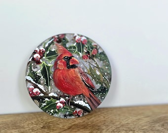 Hand Painted Male Red Cardinal in a Holly Tree Christmas Ornament: acrylic flat disk