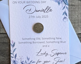 A  lucky wedding six pence mounted on an personalised A6 card for the bride on her wedding day to place in her shoe