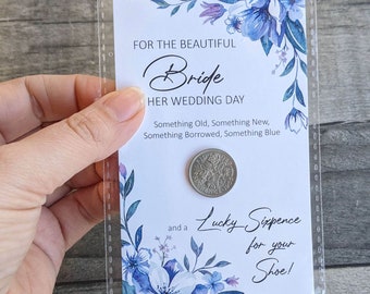 A wedding lucky six pence mounted on a card for the bride on her wedding day to place in her shoe.