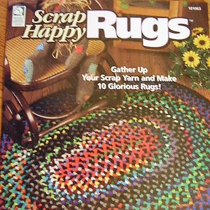 May include: A colorful braided rug with a black background. The rug is oval shaped and has a pattern of red, green, blue, and yellow yarn. The rug is titled "Angie's Braided Rug".