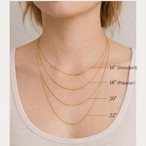 May include: Necklace length guide showing four gold chain necklaces of varying lengths: 16" (Standard), 18" (Popular), 20", and 22". The text "NECKLACE LENGTH GUIDE" is at the top of the image.