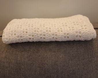 Baby Blanket Yarn crocheted off white blanket.