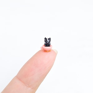 Skunk in teacup, handmade polymer clay miniature figurine