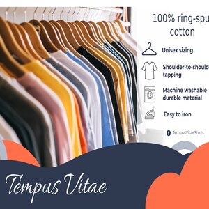 May include: A row of colorful t-shirts hanging on wooden hangers. The shirts are in various colors, including yellow, pink, and blue. The text on the image says "100% ring-spun cotton" and "Tempus Vitae".