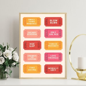 May include: A printable wall art print with a white background and 12 colorful ticket-shaped designs. Each ticket features a different relationship trope, such as "Small Town Romance", "Grumpy Sunshine", "Age Gap", "Enemies to Lovers", "Fake Dating", "Slow Burn", "Only One Bed", "Forced Proximity", "Love Triangle", and "Morally Grey".