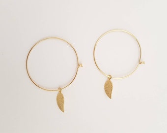 Gold filled hoops with a gold vermeil leaf