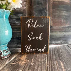 Relax Soak Unwind wood sign