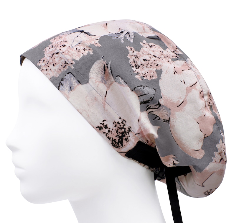 May include: Grey and pink floral print scrub hat with black ties.