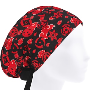 May include: A black surgical scrub cap featuring a repeating pattern of red cloud and eye designs. The cap has a black tie in the back and is displayed on a white mannequin head. The overall theme is anime.
