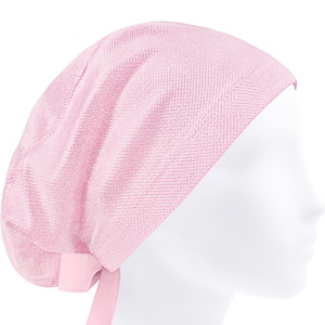 May include: A pink surgical scrub hat with a tie. The hat is made from a soft, breathable fabric and is designed to keep hair out of the way during surgery or other medical procedures.