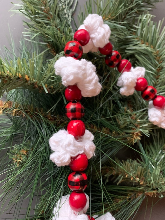 White Christmas Decorations And Popcorn Garland On Fir Tree