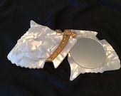 Cute stylish faux mother of pearl 1950 s Scottish terrier pocket mirror compact. Fun unique, vintage beauty item.