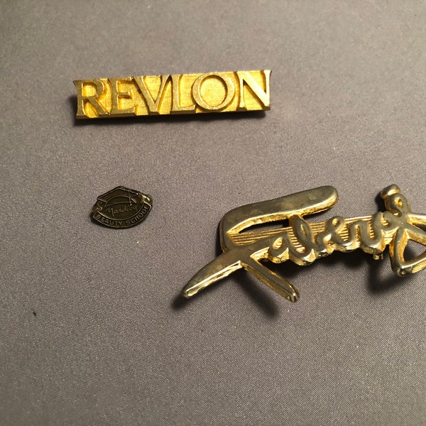 Lot of 3 vintage fashion beauty related lapel pins Revlon , Yardley Beauty School, Fabergé , I think these are sales associate pins .