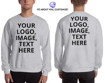 May include: Pale grey sweatshirt featuring the text "YOUR LOGO, IMAGE, TEXT HERE" on the front and back. The top has long sleeves and a crew neck. The Etsy shop name "ITS ABOUT YOU, CUSTOMIZE!" is also visible.
