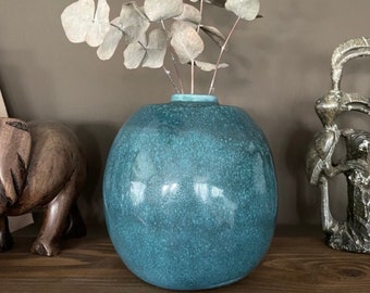 handmade blue ceramic vase. Modern ceramic ball vase