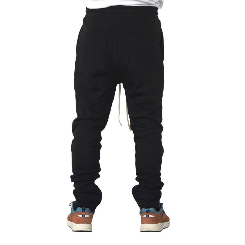 May include: Black sweatpants with a drawstring waist and a relaxed fit.