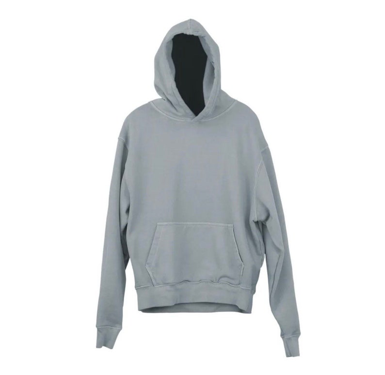 May include: A light blue hooded sweatshirt with a pouch pocket on the front.