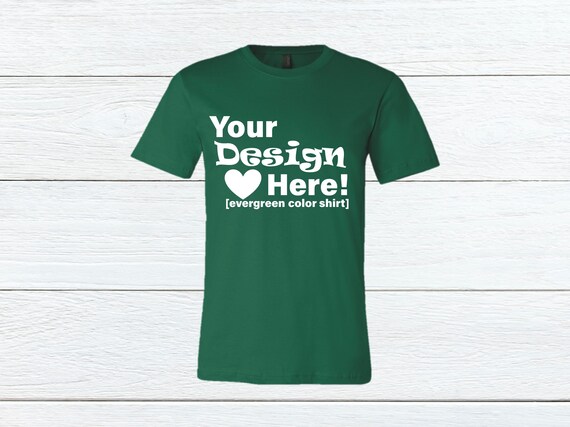 Evergreen Bella Canvas 3001 T-Shirt Mockup Wood Background Evergreen Bella Canvas 3001 T-Shirt Mockup Wood Background