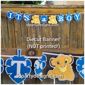 May include: It's a Boy banner with blue and yellow lion characters. The banner is made of die-cut cardstock and is not printed. The banner is strung together with white ribbon. The banner is for a baby shower or gender reveal party.