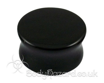 May include: Black ear gauge plug with a flared design. The plug is made of a smooth, polished material.