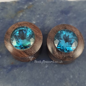 A Pair of Sono Wood 22mm Double Flared Plugs with Aqua CZ Cubic Zircon Inlays