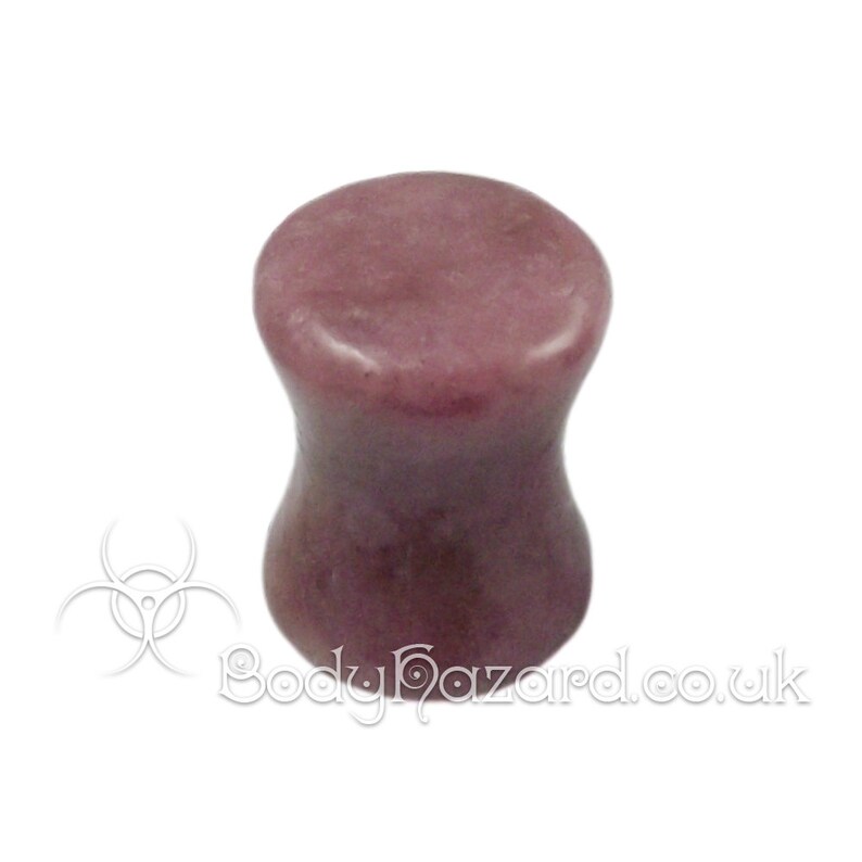 May include: A pair of purple stone ear gauges. The gauges are flared and have a smooth, polished finish.