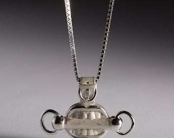 Colgante con mordaza