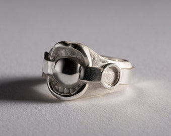 Mordaza de bola plateada