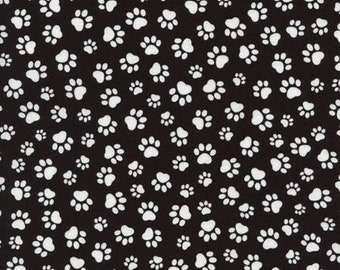 Tessuto di cotone per quilting con impronte di zampe di cane su sfondo bianco e nero, 1/2 iarda