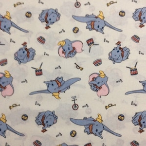 Disney Dumbo Classic Circus Fun Cream Cotton Quilting Fabric 1/2 YARD