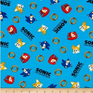 Sonic the Hedgehog Sonic z pierścieniami niebieska bawełniana tkanina pikowana 1/2 YARD