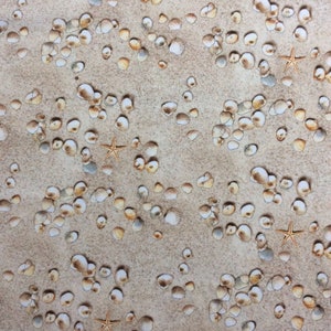 May include: A beige fabric with a repeating pattern of seashells and starfish. The fabric is textured and has a subtle sheen.