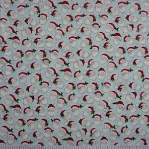 Holly Jolly Weihnachten Santa Köpfe tosed Eis Baumwolle Quilten Stoff 1/2 YARD