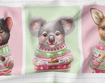 May include: Three Australian animals wearing festive Christmas sweaters. A Tasmanian devil holds a red and green gift, a koala holds a plate with a Christmas pudding, and a kangaroo holds a red ornament.