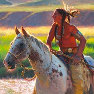 May include: A Native American man riding a spotted horse through a field of tall grass. The man is wearing a red shirt, a beaded necklace, and a feathered headdress. The horse is white with brown spots and has a rope halter.