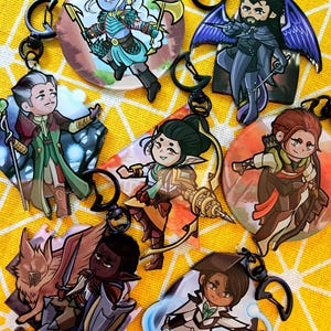 May include: Set of 8 colourful character keychains featuring fantasy characters with different expressions and poses. Each keychain is made of durable metal and features a detailed design.
