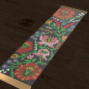 May include: A beaded bracelet with a floral design. The bracelet features a dark background with red, pink, and green flowers. The ends of the bracelet are gold-colored. The bracelet is approximately 1 inch wide.