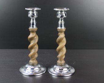 Antique pair of wooden barley twist candle holders with silver plate tops and bottoms.