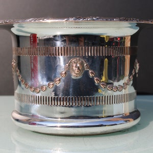 Antique large silver plated bottle holder coaster.