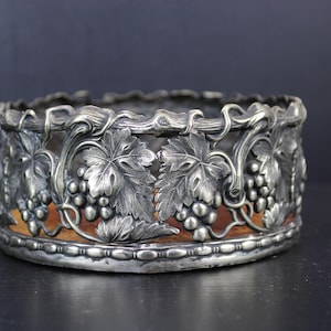 Art Nouveau floral silver plated bottle coaster holder.